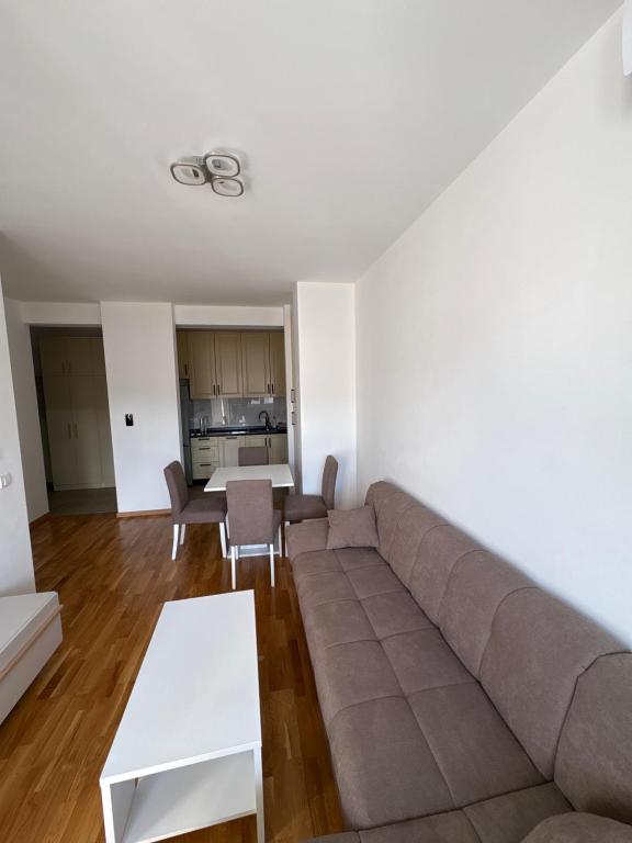 a living room with a couch and a table at Modern Apartment Laktaši in Laktaši