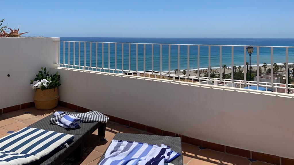 a balcony with a view of the ocean at BLUE OASIS Mojácar in Mojácar