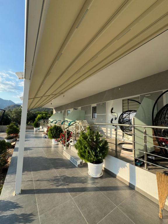 a balcony of a building with potted plants at Horizonte Blu in Borsh