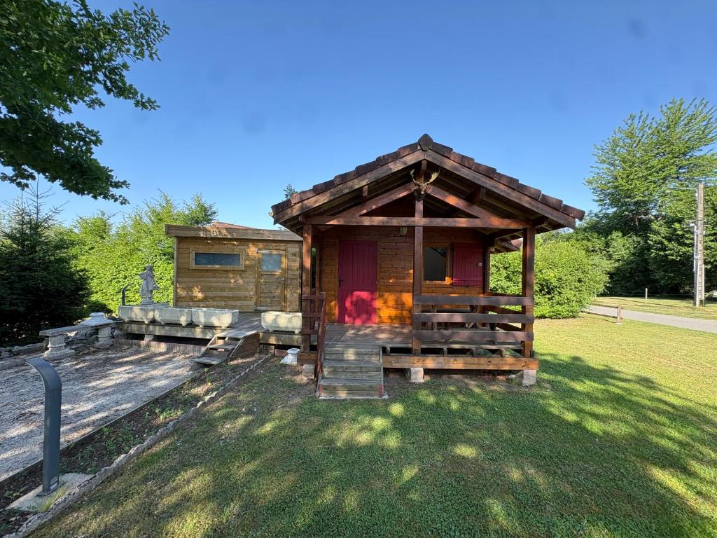 a log cabin with a fire inside of it at Chalet Le CERF in Marigny