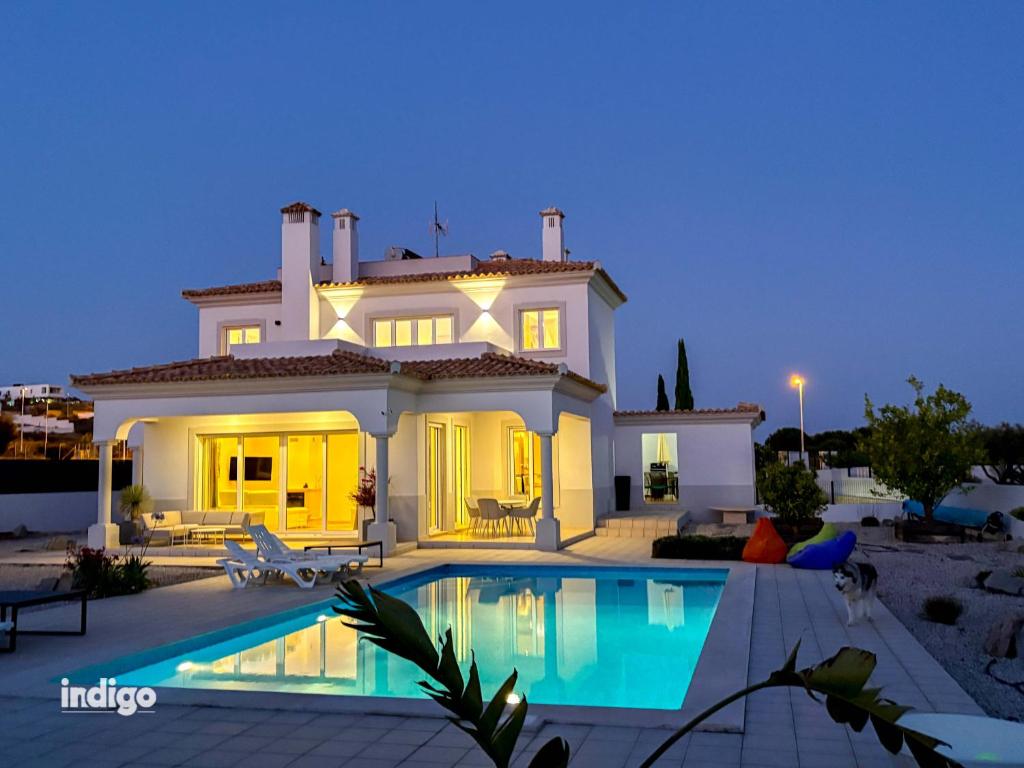a villa with a swimming pool at night at Villa Nichan - Private Pool - NIC01 in Ayamonte