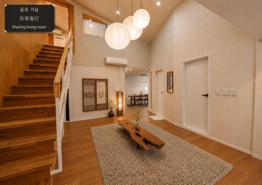 a living room with a bench and a staircase at On Stay - Hotel Quality Stay in Seoul