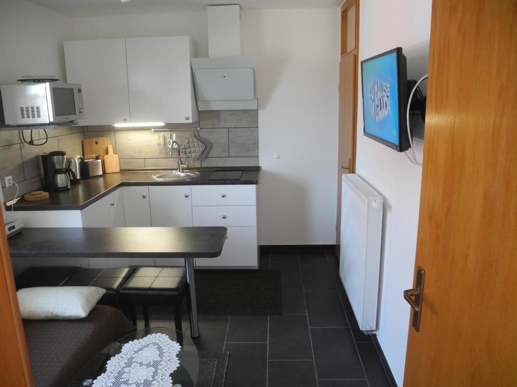 Kuchyň nebo kuchyňský kout v ubytování Ferienwohnung Wünsche