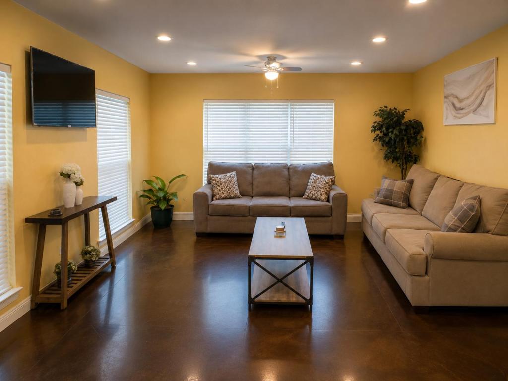 a living room with a couch and a table at Ground Floor, 3BR, Free Parking, Near Refinery -E- in Moss Point