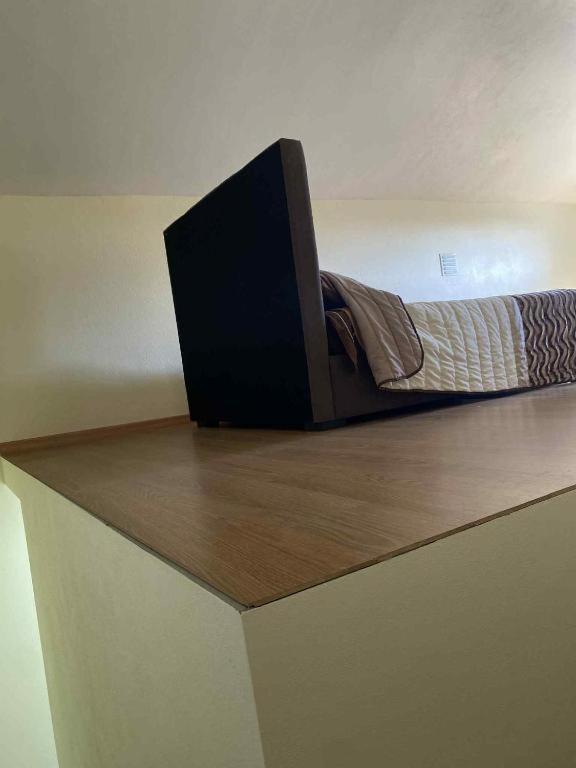 a bed sitting on top of a counter at Lajes guests house in Lajes
