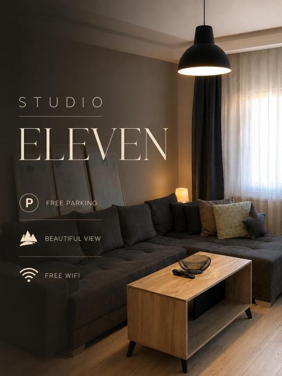 a living room with a couch and a coffee table at Studio Eleven - Free Parking in Čajetina