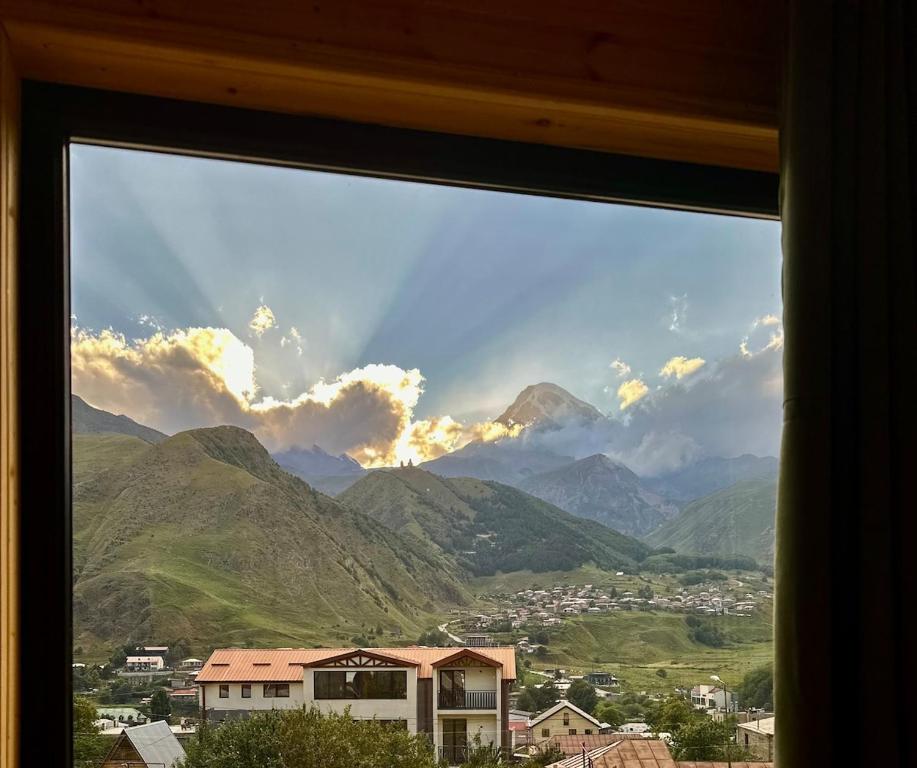 a view of a mountain view from a window at Mountain Stories Kazbegi-Stepantsminda in Kazbegi