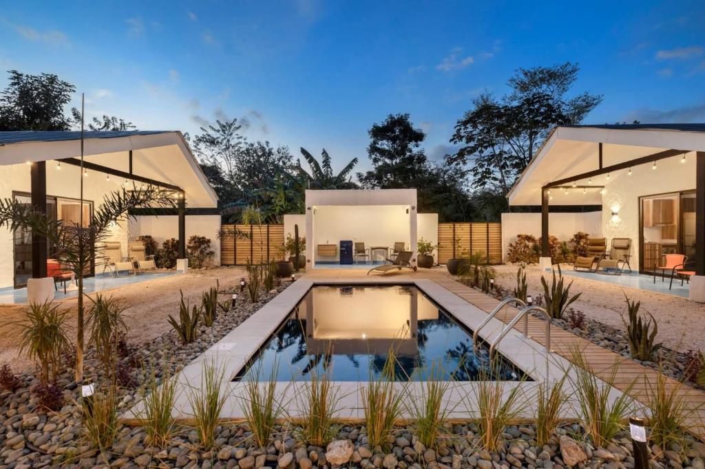 an exterior view of a house with a swimming pool at Villa Peuchere in Santa Cruz