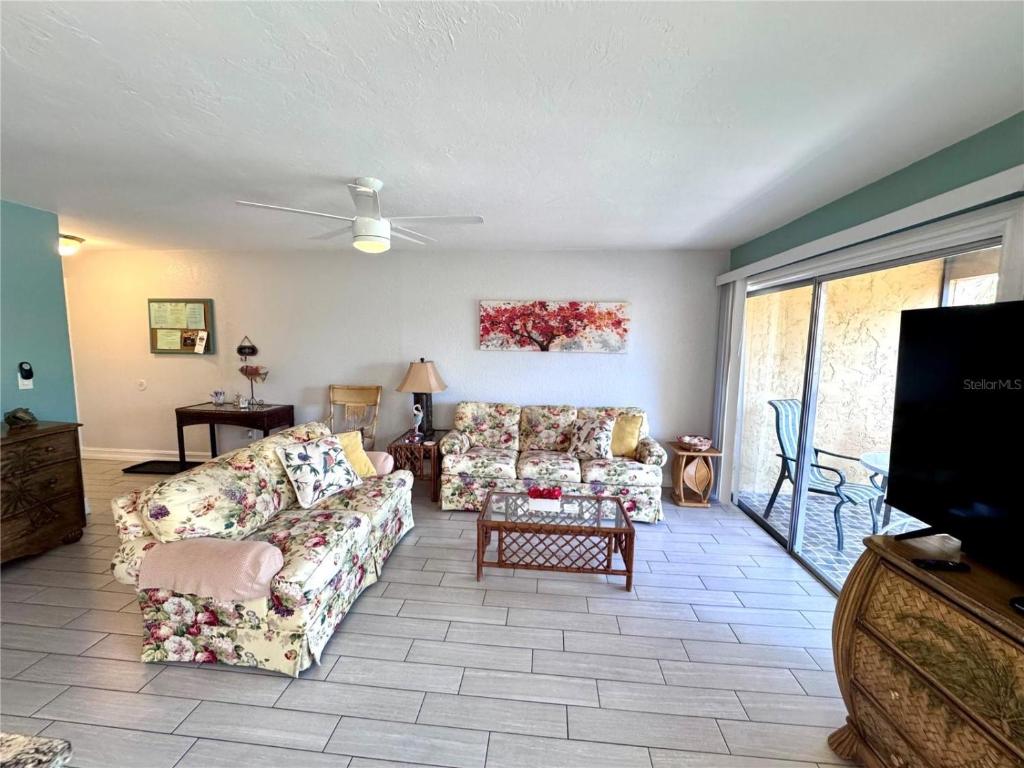 a living room with two couches and a flat screen tv at 1+1 Large condo Sarasota in Sarasota