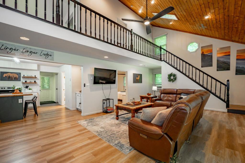 a living room with a couch and a ceiling fan at Peace at Last by Railey Vacations in McHenry