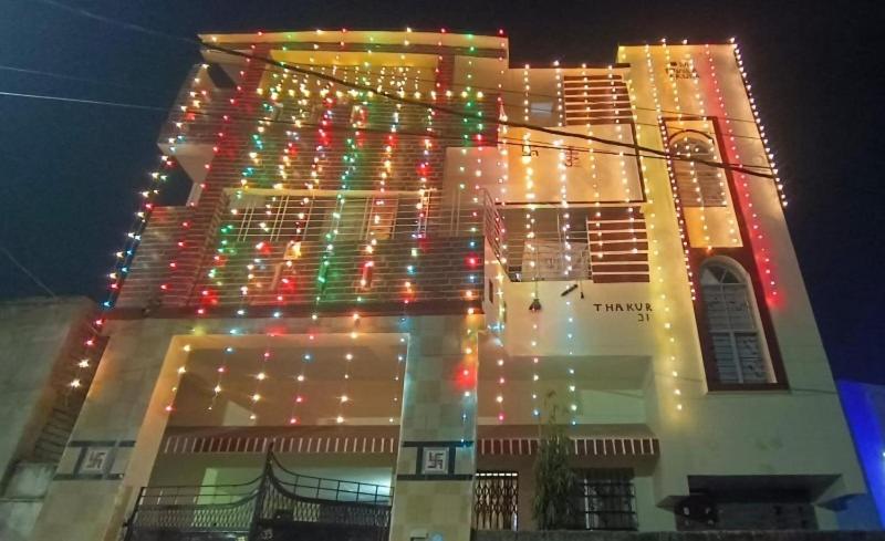 a lit up building with christmas lights on it at OM Tower in Jamshedpur