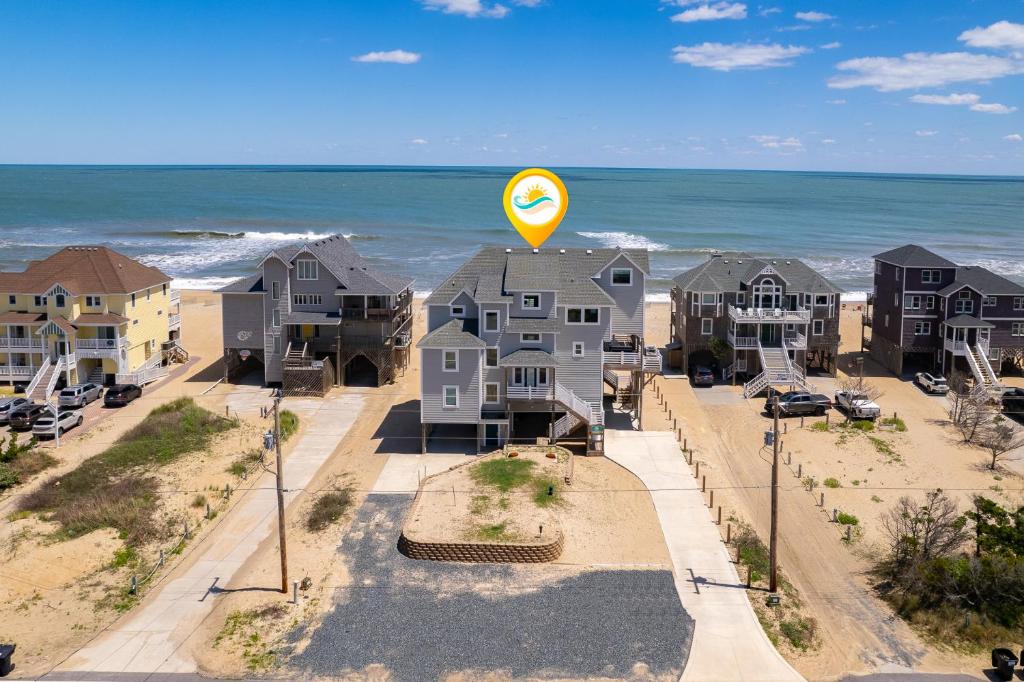an aerial view of houses at the beach at 8078 - Groovin' in Avon
