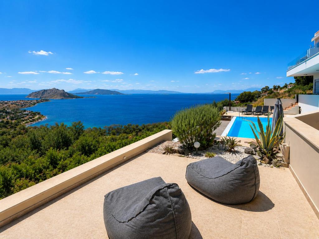 a view of the ocean from a house at Villa Harmonia in Egina