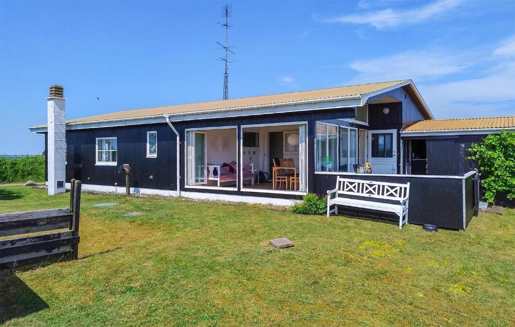 a black house with a large yard in front of it at 3 Bedroom Cozy Home In Haderslev in Haderslev