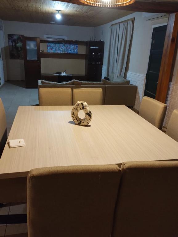 a table in a room with chairs around it at Casa quinta Los Teros in Sánchez de Loria