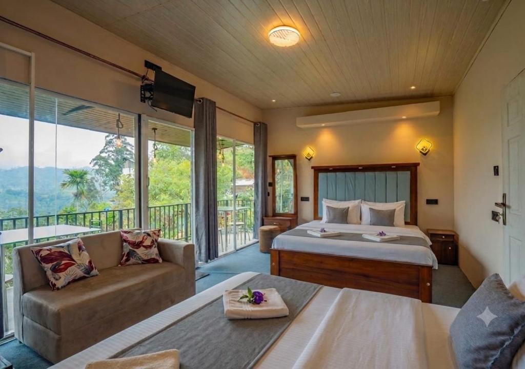 a bedroom with a bed and a living room with a couch at Lavee Villa Ella in Ella