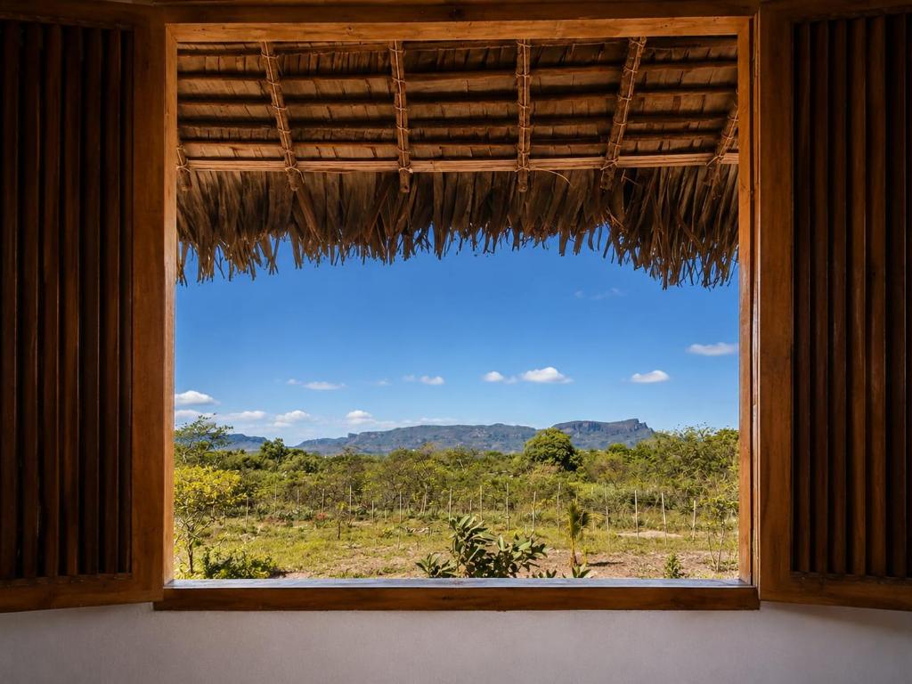 a window in a room with a view of a field at Casa Lantana in Antsiranana