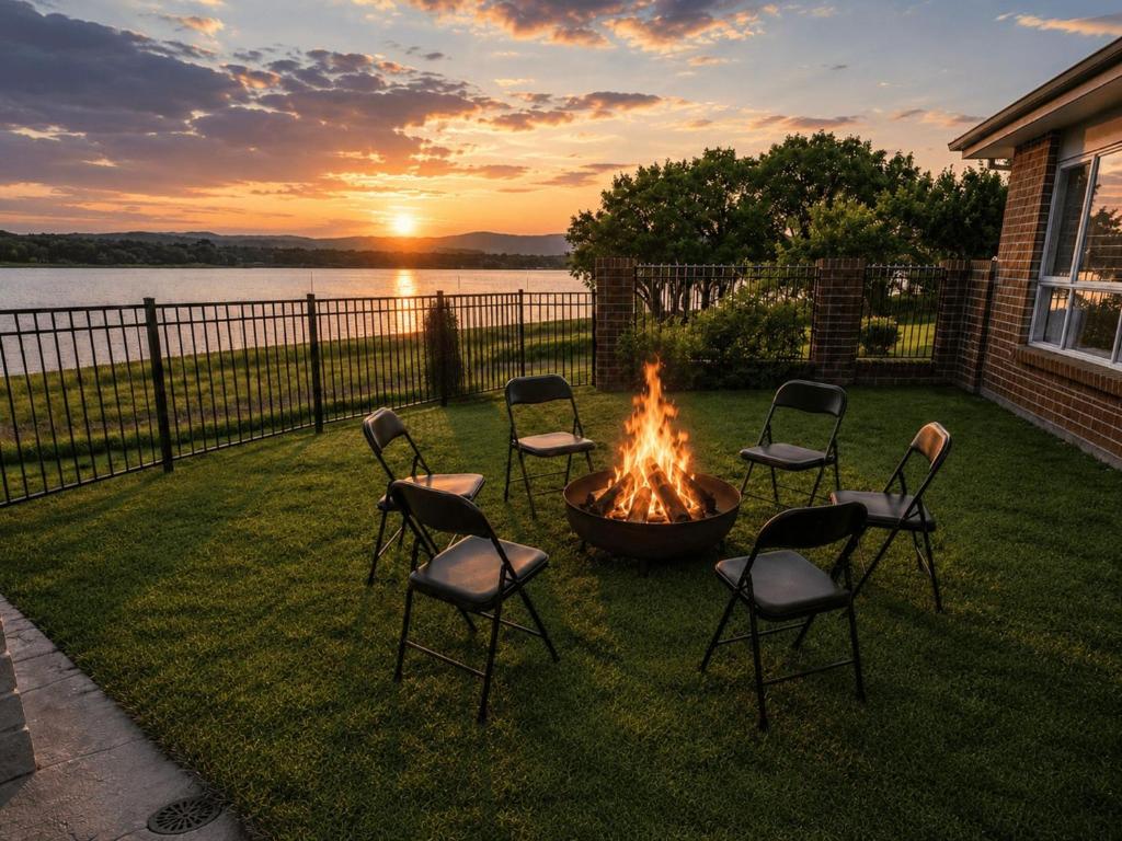 a group of chairs sitting around a fire pit at Waterside Escape St Hubert s Island in Saint Huberts Island