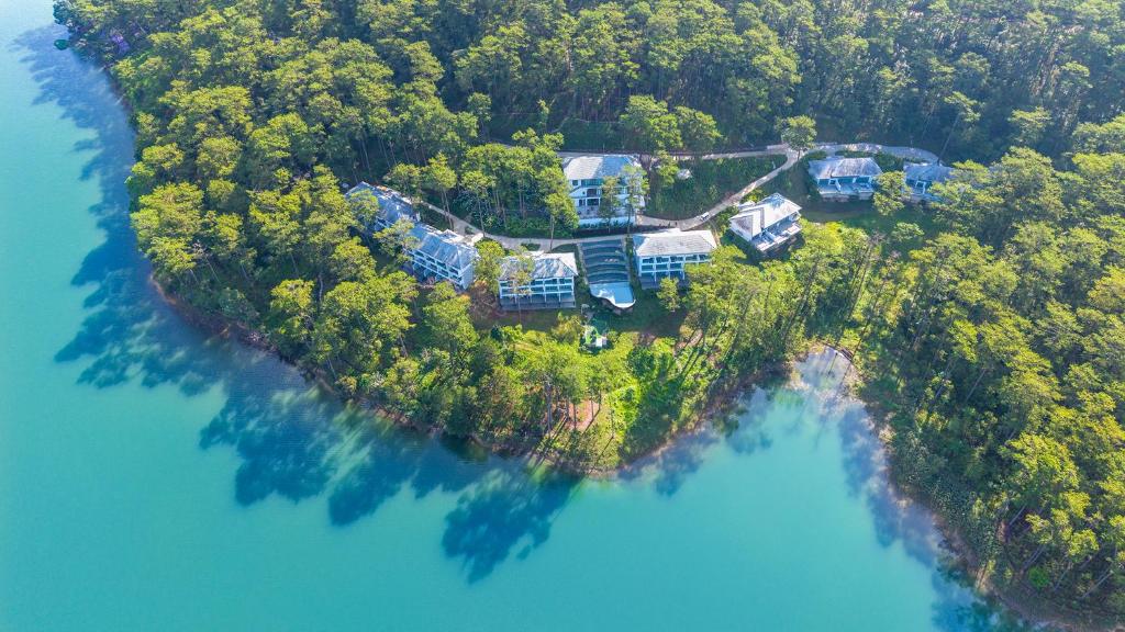 an aerial view of a house on an island in the water at Haven in the Pines in Da Lat