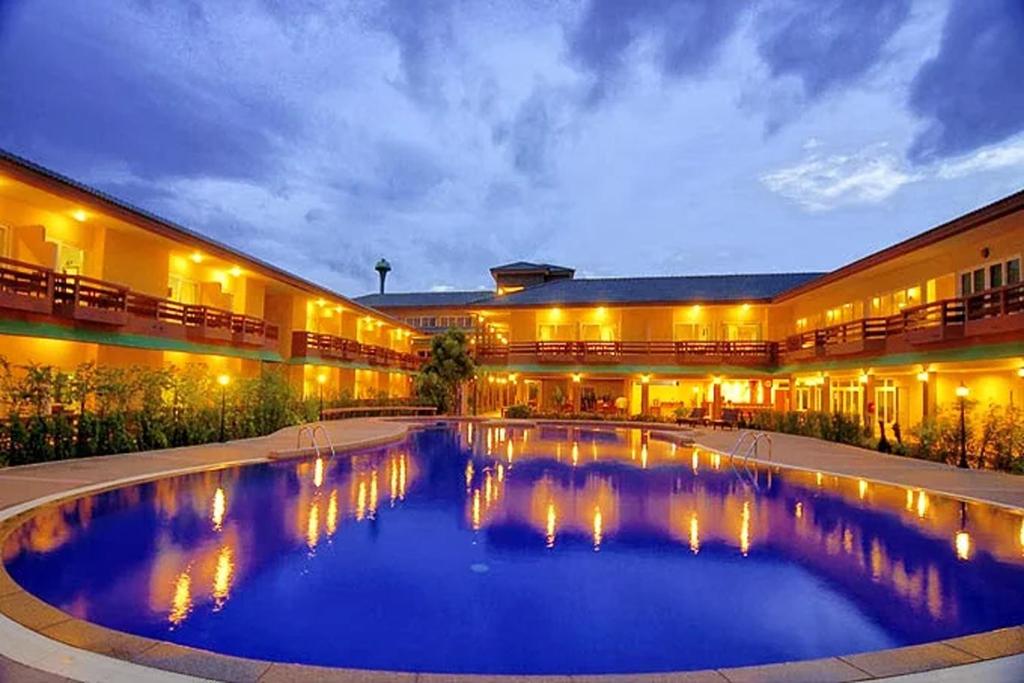 a large pool in the middle of a building at Bacchus Home Resort Pranburi in Ban Pak Nam Pran