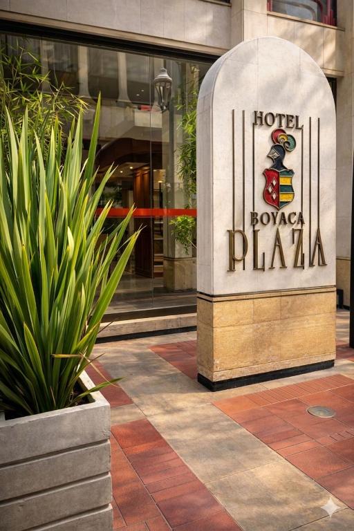 a hotel tower plaza sign in front of a building at Hotel Boyaca Plaza in Tunja