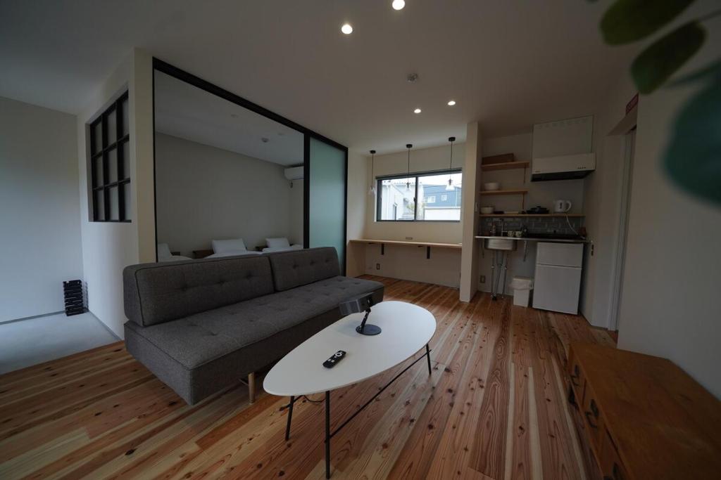 a living room with a couch and a table at 紀の川みんと静 in Kinokawa
