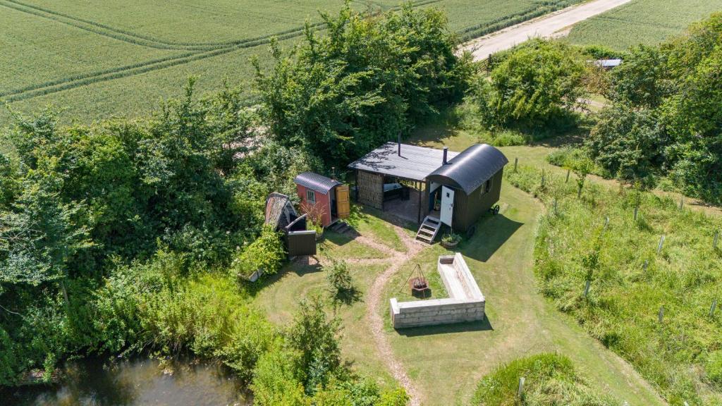 an aerial view of a small house in a field at Stompy's Hut in Laxfield