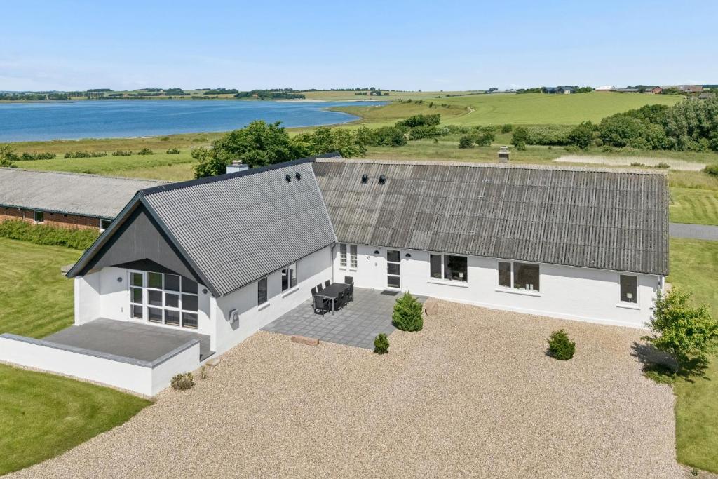 an overhead view of a white house with a roof at Spacious Holiday Home With Water View in Redsted