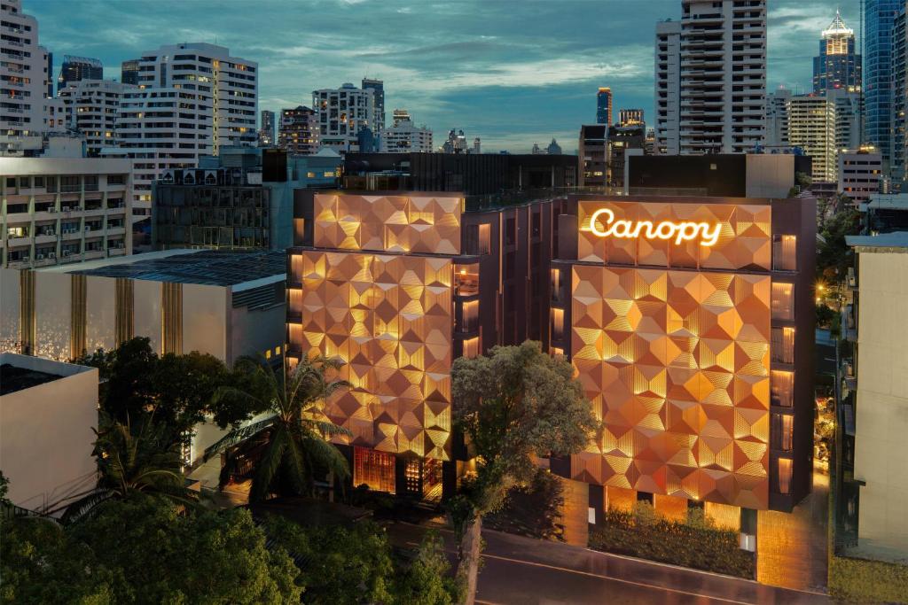 a rendering of a building with a sign on it at Canopy By Hilton Bangkok Sukhumvit in Bangkok
