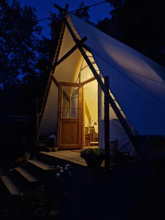 a small tent with a door at night at Tente Lodge Logement Insolite 4pers Campagne Normande Orne in Ménil-Hubert-sur-Orne