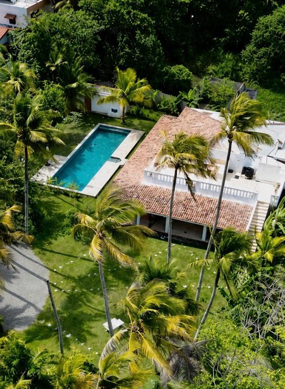 an aerial view of a house with a swimming pool at Mayava Villa in Ahangama