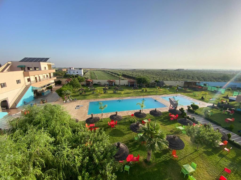 an overhead view of a pool at a resort at La ferme labyed in Fez