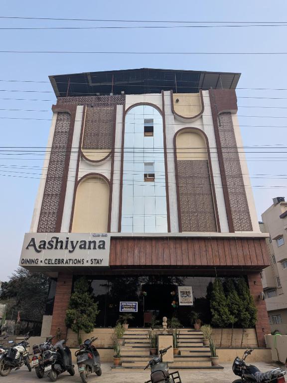 a building with motorcycles parked in front of it at Hotel Aashiyana in Shahdol