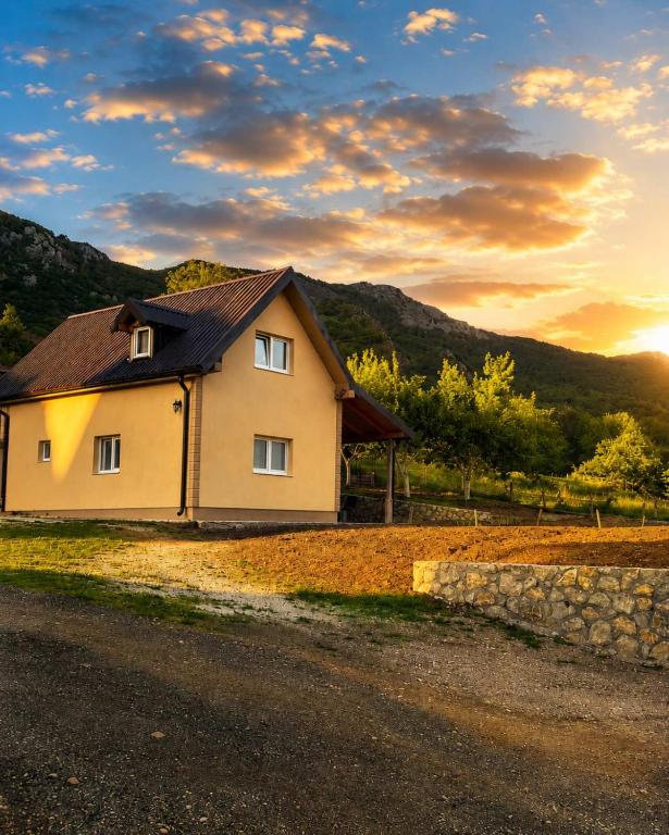 a house sitting on the side of a road at Lipovo Mountain House in Kolašin