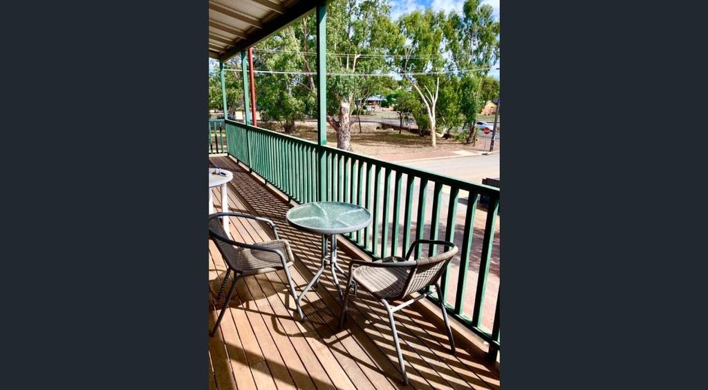 a patio with a table and chairs on a balcony at Nest & Rest York in York