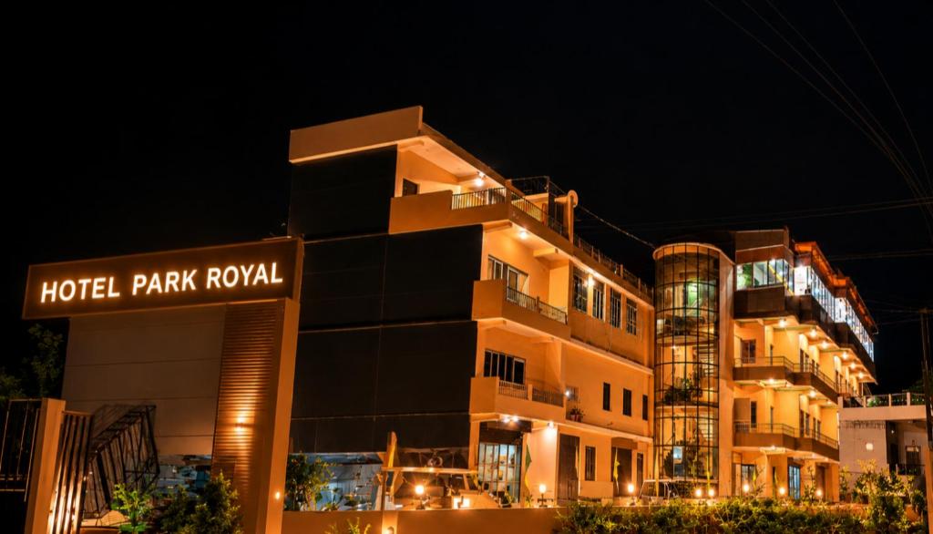 a building with a hotel park royal at night at Hotel Park Royal in Pithorāgarh