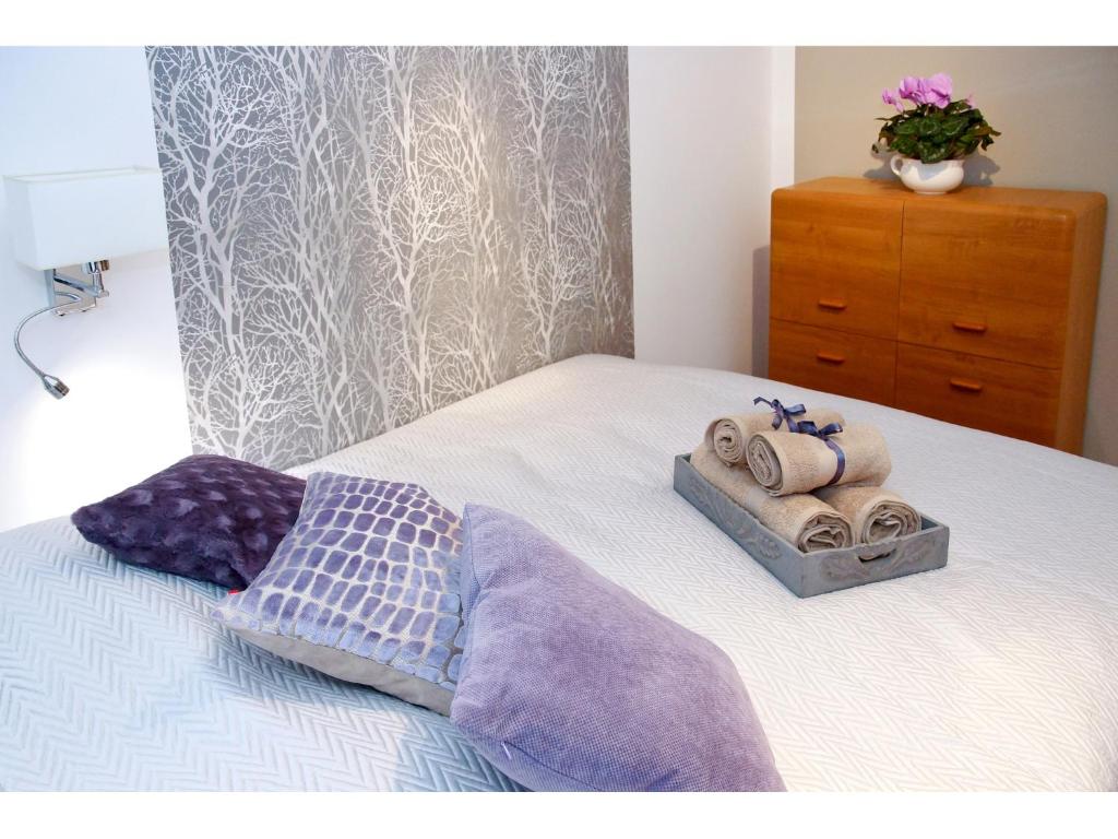 Posteľ alebo postele v izbe v ubytovaní Srebrna Warsaw Apartment