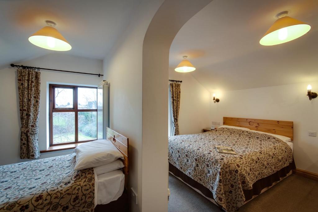 Postel nebo postele na pokoji v ubytování Parr Hall Farm, Eccleston
