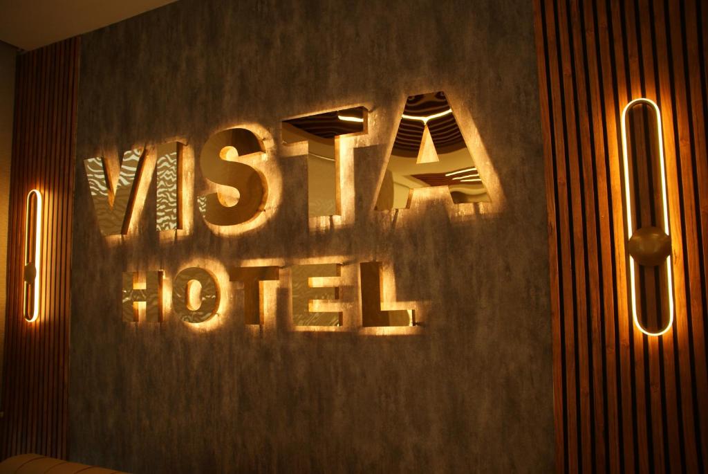 a sign that says risk hotel on a wall at Vista Kayseri Hotel in Kayseri