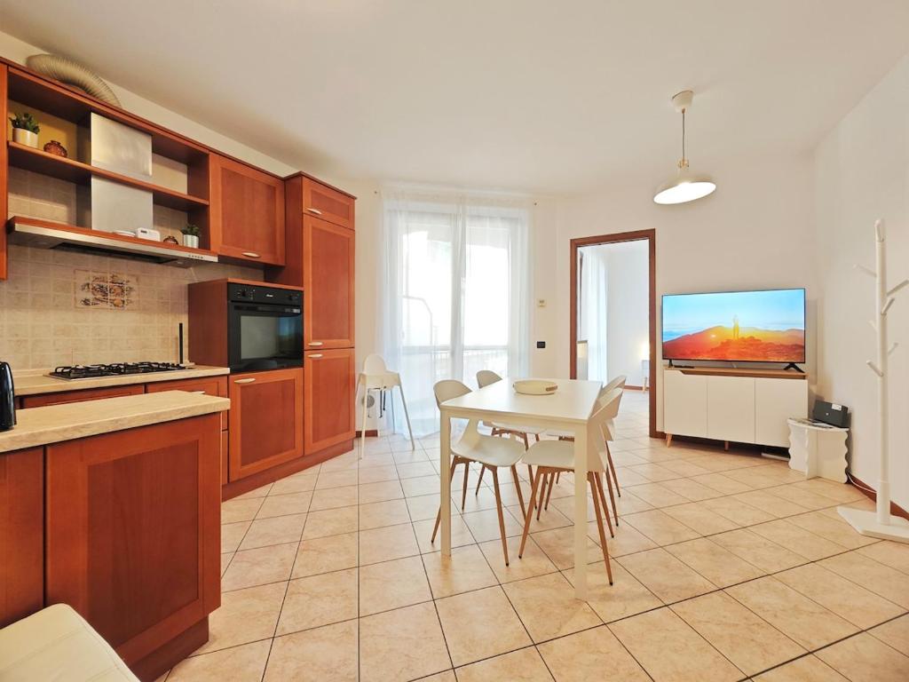 a kitchen with a table and a television in it at Route 600 in Intra