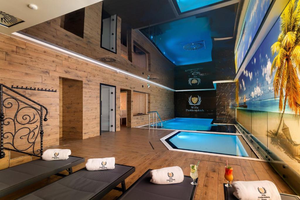a large room with a swimming pool in a building at Willa Pieńkowskich in Gdynia