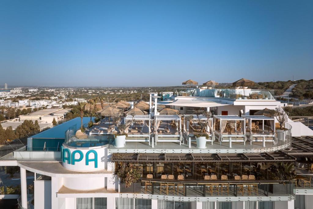 a building with a pool and a resort at Hotel Napa Suites (Adults Only) in Ayia Napa
