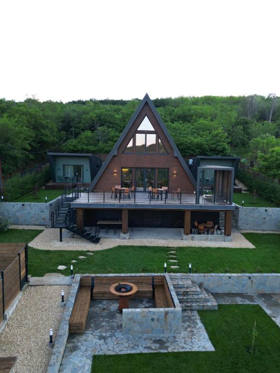 an aerial view of a large house with a roof at Colina Monteoru in Sărata-Monteoru