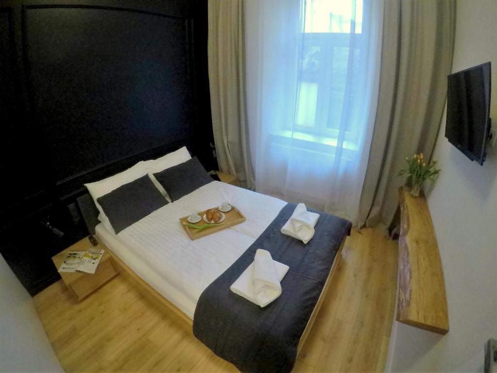 Katil atau katil-katil dalam bilik di Old Town, Loft Style Apartment