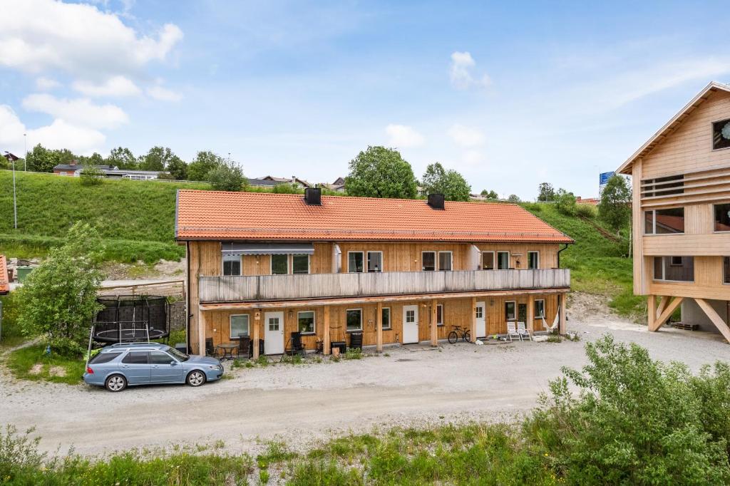 a house with a car parked in front of it at Olen Village - Funäsdalen in Funäsdalen