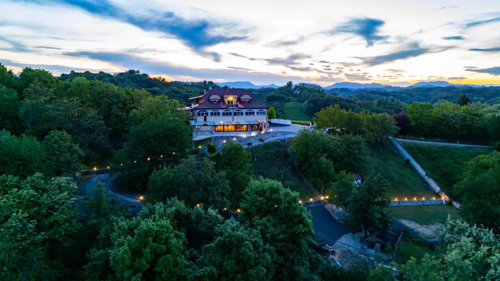 an aerial view of a mansion with a sunset at Vila Ribič in Železnička Stanica Žejinci