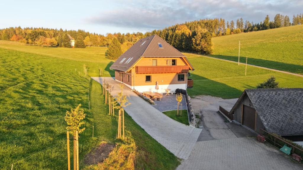 an aerial view of a house in a field at Kapellenhof Ferienwohnungen in Triberg