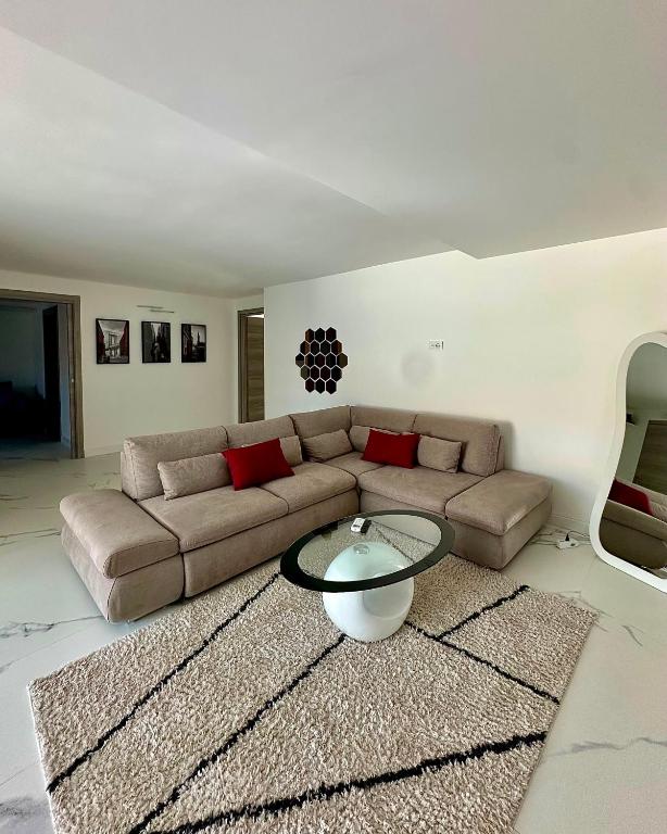 a living room with a couch and a table at Villa Olimpia in Civitavecchia