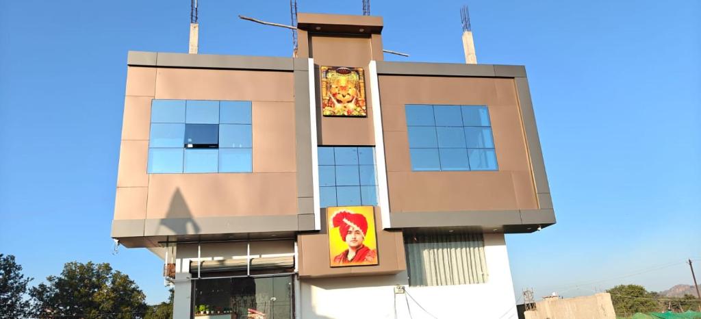 a building with signs on the side of it at Hotel ram priya in Chhatarpur