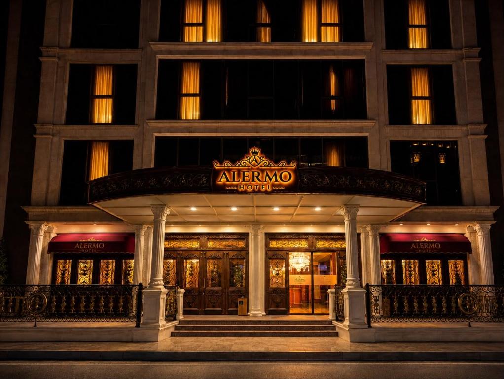 an entrance to a building with a sign on it at Alermo Hotel-SPA in Baku